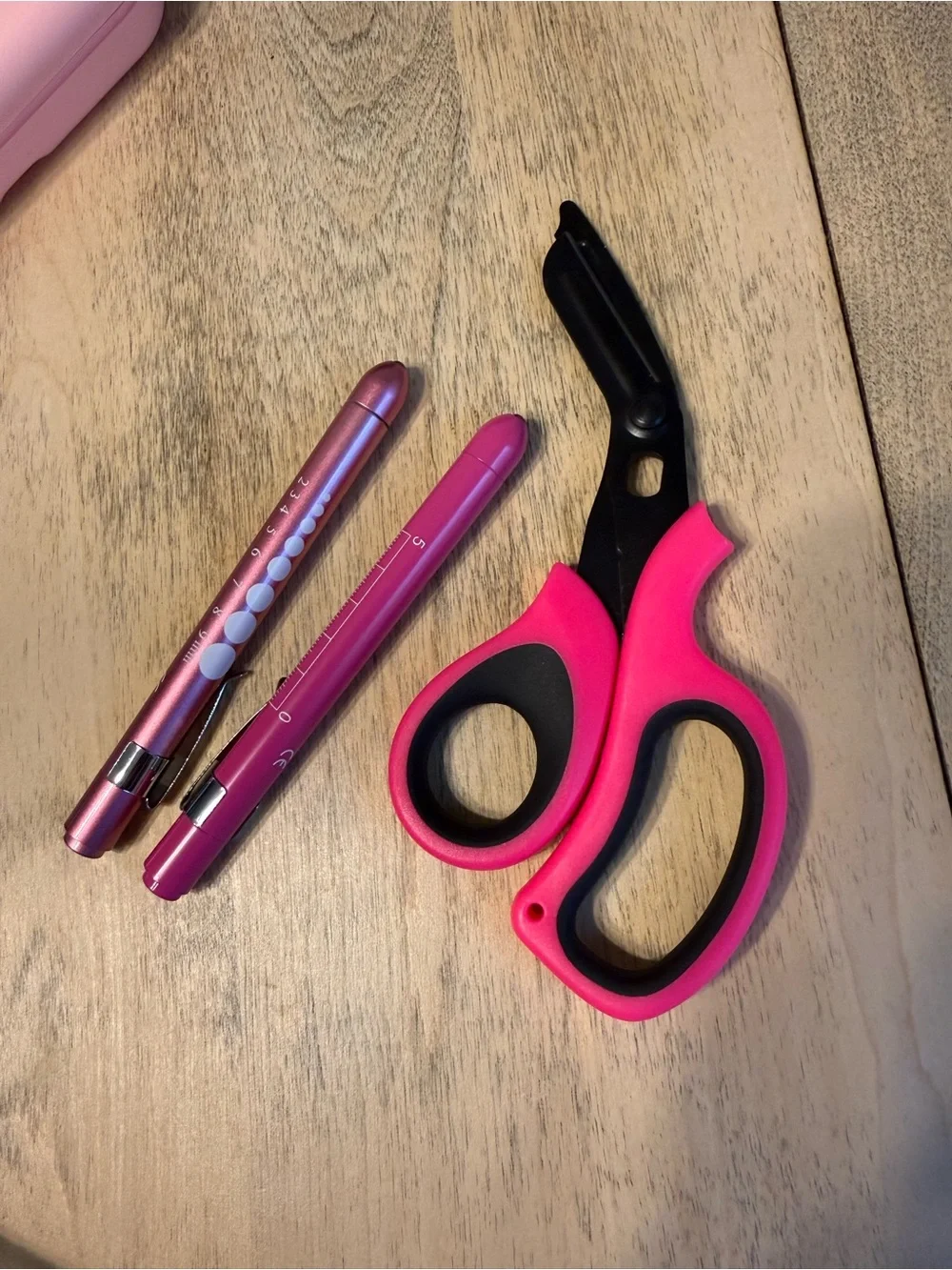 Two Pink Pen Lights and Scissors